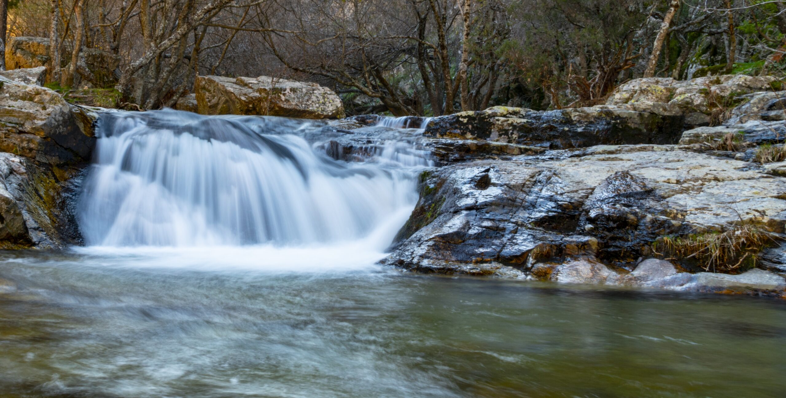 A beautiful shot of a small waterfall coming from the thaw